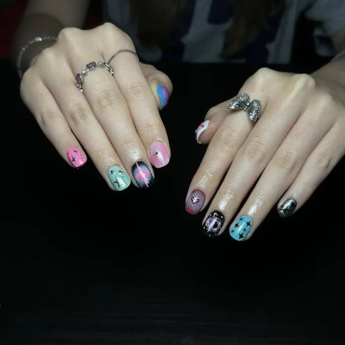 A neon set in mint, pink and black with chrome detailing across the tips